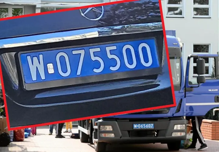 Niebieska tablica rejestracyjna z numerem W-075500 na samochodzie ciężarowym.