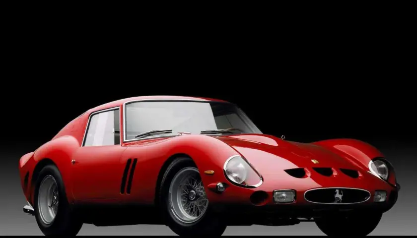 Czerwone Ferrari 250 GTO na czarnym tle.